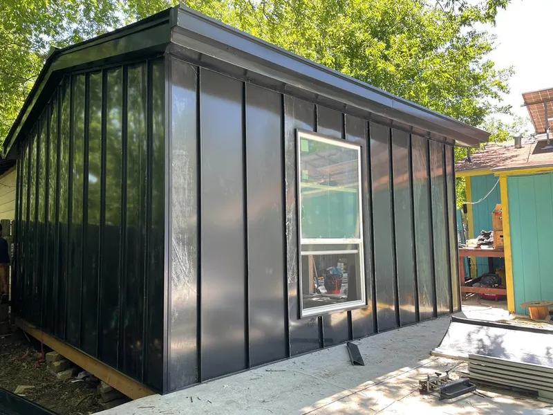 Black standing seam metal wall panels for Metal Roof Installation in Grimes