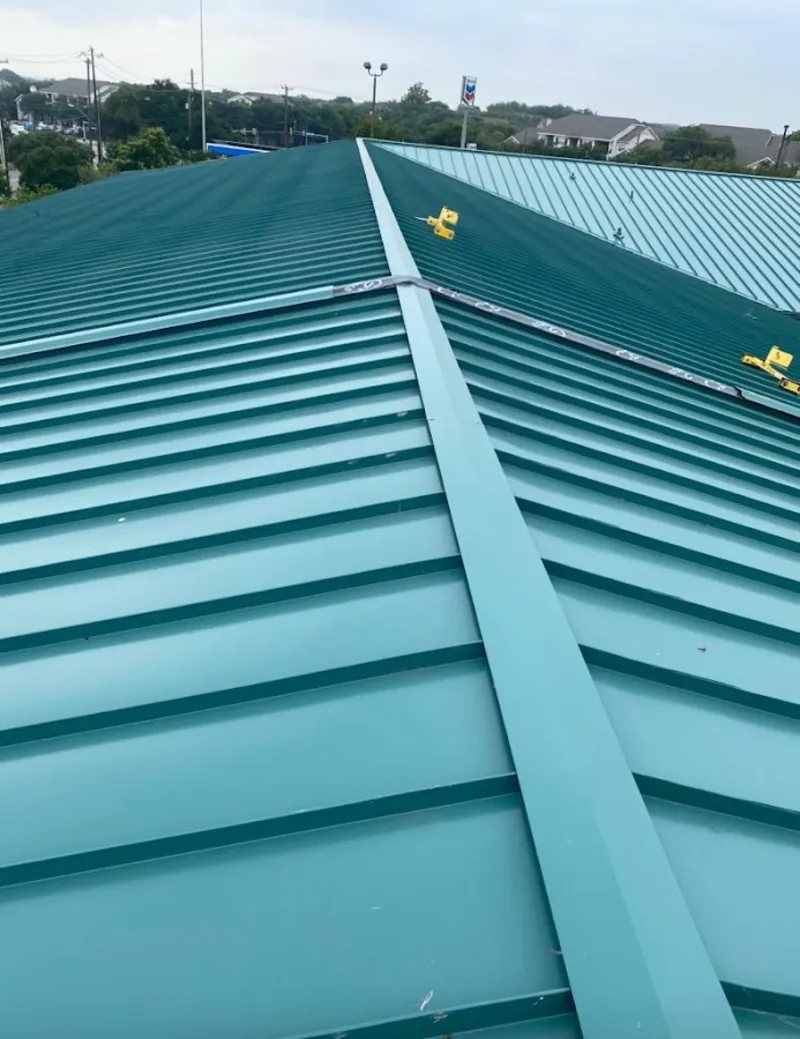 Green commercial metal roof ridge and valley for Metal Roof Repair in Grimes